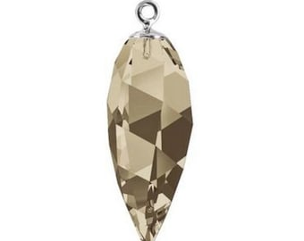 May include: A faceted, teardrop-shaped crystal pendant with a silver-coloured metal loop at the top. The crystal is a light brown colour with multiple facets that reflect light. The pendant is designed for jewellery making.