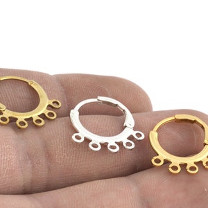 May include: Three hoop earring findings with five jump rings each. The hoops are available in gold, silver, and brass.