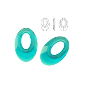May include: Two turquoise oval-shaped crystal beads with a hole in the center. The beads are faceted and have a shiny finish.