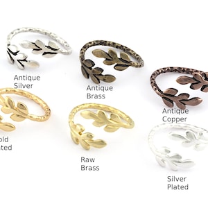 May include: Six adjustable rings with a leaf design in different finishes: antique silver, antique brass, antique copper, gold plated, raw brass, and silver plated.