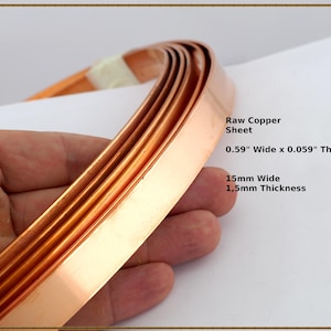 May include: Close-up of raw copper sheet, 15mm wide x 1.5mm thick, bent in a curve. The text on the image reads "0.59" Wide x 0.059" Thick". The copper strips are a warm, reddish-brown colour.
