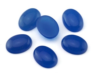 May include: Six oval-shaped blue cabochon gemstones on a white background.
