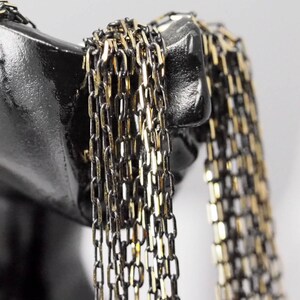 Brass soldered chain 2,5x6mm Gold tone and black z062