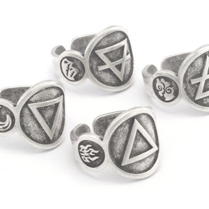 May include: Four silver rings featuring different symbols. Each ring has a round symbol with a triangle inside. The symbols are air, earth, fire, and water.