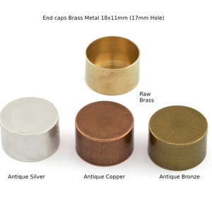 May include: A collection of brass metal end caps in various finishes. The image shows a raw brass cap, an antique silver cap, an antique copper cap, and an antique bronze cap. The text indicates the caps are 18x11mm with a 17mm hole.