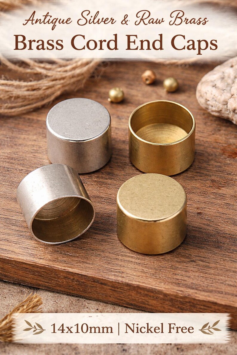 May include: Four brass cord end caps in antique silver and raw brass finish are displayed on a wooden surface. The caps are cylindrical, with two in silver and two in gold. The text "Antique Silver & Raw Brass Brass Cord End Caps" is at the top. The text "14x10mm | Nickel Free" is at the bottom.