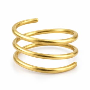 May include: A gold-toned ring featuring a continuous spiral design with three distinct coils. The metal has a smooth, matte finish and a rounded profile, forming an open-ended structure that wraps around in a circular, layered pattern.