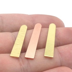May include: Three metal strips in different colors: gold, copper, and brass. The strips are all the same size and shape, and they are arranged in a row.