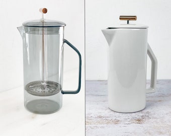 fairly manufactured coffee pot | French Press | made of ceramic | made of gray glass | minimalist design and excellent quality.