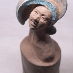 Expressive Ceramic Woman Bust Sculpture: Turquoise Accent, Handcrafted Art