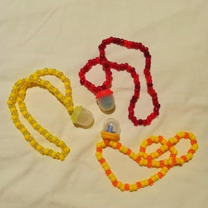 Toy capsule kandi necklaces