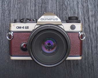 Olympus OM-4T Titanium 35mm Film Champagne SLR Camera Body W/ Grip