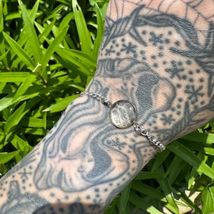 Bracelet ajustable en acier inoxydable peau de serpent.