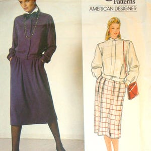 May include: Vogue Patterns sewing pattern featuring designs by Oscar de la Renta. The pattern includes illustrations of two outfits: a long-sleeved purple dress and a white shirt with a plaid skirt. The pattern number is 1186.