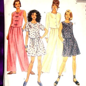 May include: A McCall's sewing pattern envelope, number 7595, size G (20, 22, 24). The front displays illustrations of four different outfits: a pink sleeveless top with wide-leg pants, a floral print short set, a cream jacket with pants, and a floral print top with shorts.