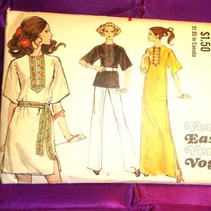 May include: A Vogue sewing pattern envelope 7808, size small, featuring illustrations of three garments: a white tunic with floral trim, a black top with white pants, and a yellow maxi dress. The text reads Vogue Pattern, 7808, and Very Easy Very Vogue.