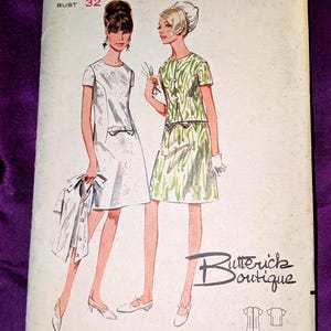 May include: Vintage Butterick sewing pattern, size 12, featuring illustrations of two women in dresses. The pattern includes a dress and a matching jacket. The bust size is 32 inches. The pattern is from Butterick Boutique.