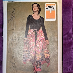 May include: A vintage Simplicity sewing pattern, number 5082, featuring a woman in a long skirt and top. The pattern includes illustrations and text, with the words "Super Jiffy" and "One Size" visible. The price is listed as 75¢ in the USA and 85¢ in Canada.