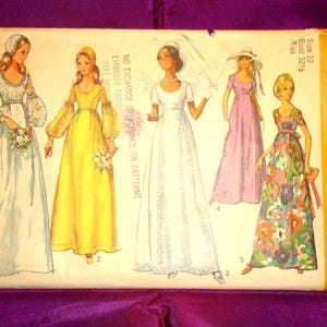 May include: Vintage Simplicity sewing pattern envelope featuring illustrations of five different long dresses. The envelope is yellowed with age and includes the text "9260 Simplicity" and size information. The dresses include a wedding dress and other formal gowns.
