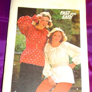 May include: Vintage Dauerich sewing pattern featuring two women modeling clothing. The pattern cover has the text "FAST and EASY" and the price $1.25. The models are wearing a red floral top and a white top with a bow.
