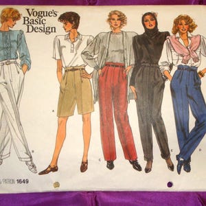 May include: Vintage Vogue's Basic Design pattern 1649 featuring illustrations of five different outfits. The outfits include a light blue blouse and white pants, a white polo shirt and khaki shorts, a gray sweater and red pants, a black turtleneck and gray pants, and a white shirt and blue pants.