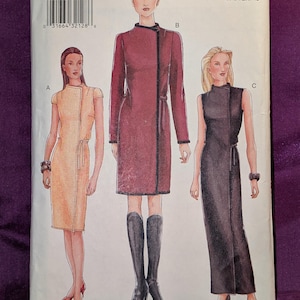 May include: Vogue Patterns sewing pattern 7311. The pattern features illustrations of three different dresses. The cover includes the text "VOGUE PATTERNS" and the pattern number, size, and style information.