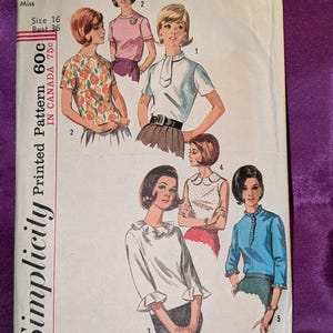 May include: A vintage Simplicity sewing pattern envelope, number 5885, for a miss size 16 with a 36-inch bust. The front features illustrations of five different blouse styles, including floral, solid, and ruffled designs, with text indicating the pattern number and sizing details.