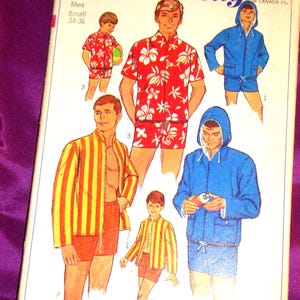 May include: A vintage Simplicity sewing pattern envelope 7146 featuring illustrations of various outfits including a red floral shirt and shorts set, a yellow and orange striped jacket and shorts set, and a blue hooded jacket with matching shorts.