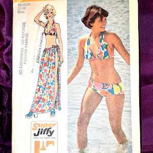May include: A vintage Simplicity sewing pattern, number 5644, featuring a bikini and skirt design. The pattern includes a drawing of the finished garments and the text "Super Jiffy". The pattern is for a medium size 12-14.
