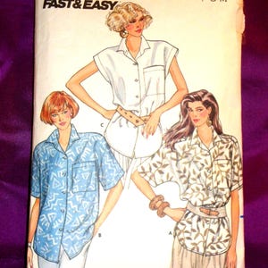 May include: A vintage Butterick sewing pattern, number 4852, featuring illustrations of three women wearing button-down shirts. The pattern includes the text "FAST & EASY" and "P-S-M" sizing. The shirts have various patterns, including a white, blue, and leaf design.