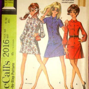 May include: Vintage McCall's 2016 sewing pattern for young junior/teen dresses in three versions. The pattern features illustrations of the dresses in paisley, blue, and red. The cover includes the text "NEW EASY" and "Step-by-Step Pattern".