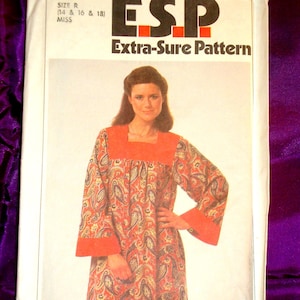 May include: Simplicity sewing pattern 8752 featuring a woman in a paisley print dress. The pattern is labeled "ESP Extra-Sure Pattern" and includes sizes 14, 16, and 18. The price is marked as 95¢.