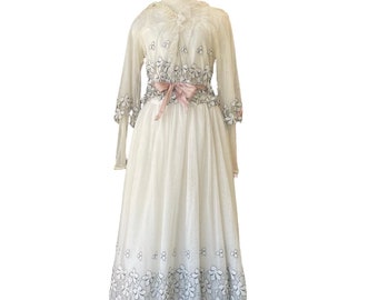 1910s Net Lace Dress with Flower and Ribbon Trim. Layered White Gown with Floral Embellishment. Vintage Wedding Dress with Double Sleeves.