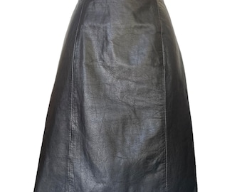 1990s Black Leather Pencil Skirt. Knee Length Leather Skirt with Back Snap Vent by G III. Size Small, 28" Waist, 40" Hips.