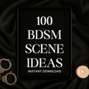 May include: A black tablet displays the text "100 BDSM SCENE IDEAS INSTANT DOWNLOAD" in white. Silver handcuffs and a lit candle are on a black satin surface.