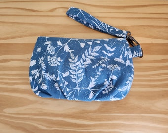 Soft white leaves on blue wristlet or clutch with detachable wrist strap