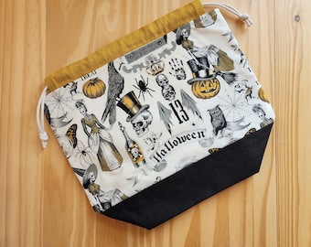 Large Halloween project bag for knitting, crochet, or embroidery with drawstring and pockets; spooky crafting bag