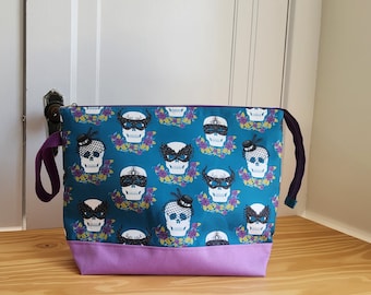 Extra large masked skulls project bag for knitting, crochet, or embroidery with zipper closure and wrist strap, slip pockets inside