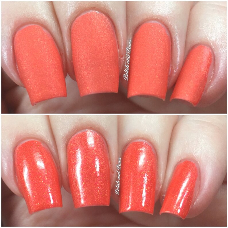 May include: Close-up of fingernails painted with a bright orange nail polish. The polish has a subtle shimmer and is shown in both matte and glossy finishes.