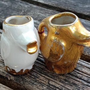Pair of mini porcelain ducks, toby style