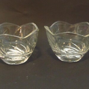 Nice pair of Lotus clear etched glass cups or candle holders with vine decor.
