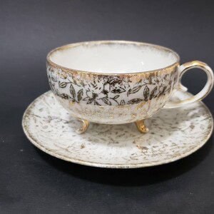 Ceramic Iresdiscent Pearlescent lusterware Teacup and Saucer Set. Gold gilt flowers Gold Gilt Teaset. Triad feet teacup,  Victorian set