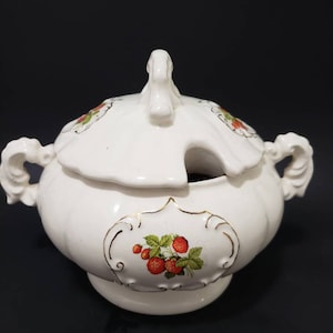 May include: A set of three ceramic vases in varying heights and shapes. The vases are glazed in a matte white finish, with subtle variations in texture. The tallest vase is approximately 10 inches high.