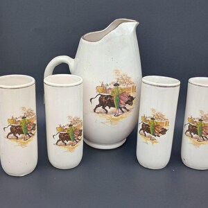 Set of five ceramic matador, spanish bull fighter, pitcher and glasses