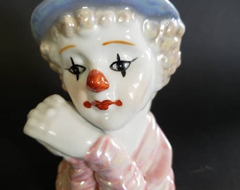 Bisque ceramic clown. One irredescent clown,  bust figurine clown