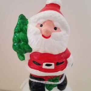 Christmas, ceramic santa with christmas tree, ceramic bell, made in Taiwan.
