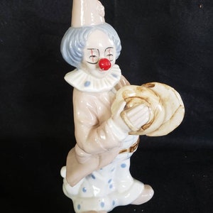 Porcelain clown cymbal musical player
