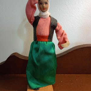 Doll with cordugated board base dancing lady doll wired and stuff body cotton silk garment from Israel. size 8 1/2 inches.