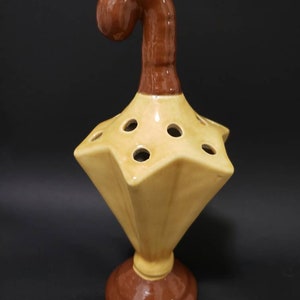 Ceramic gold and brown glaze umbrella pencil holder.