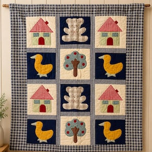 May include: A rectangular fabric wall hanging featuring a grid of twelve quilted squares. The design includes alternating blocks of light green houses with red roofs, yellow ducks, grey teddy bears, and trees with red fruit on a dark blue background.